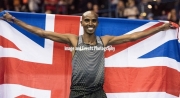 Mo Farah celebrates his victory in the 3000 mtrs at the Barclaycard Arena, Birmingham, England. The Muller Indoor Grand Prix.