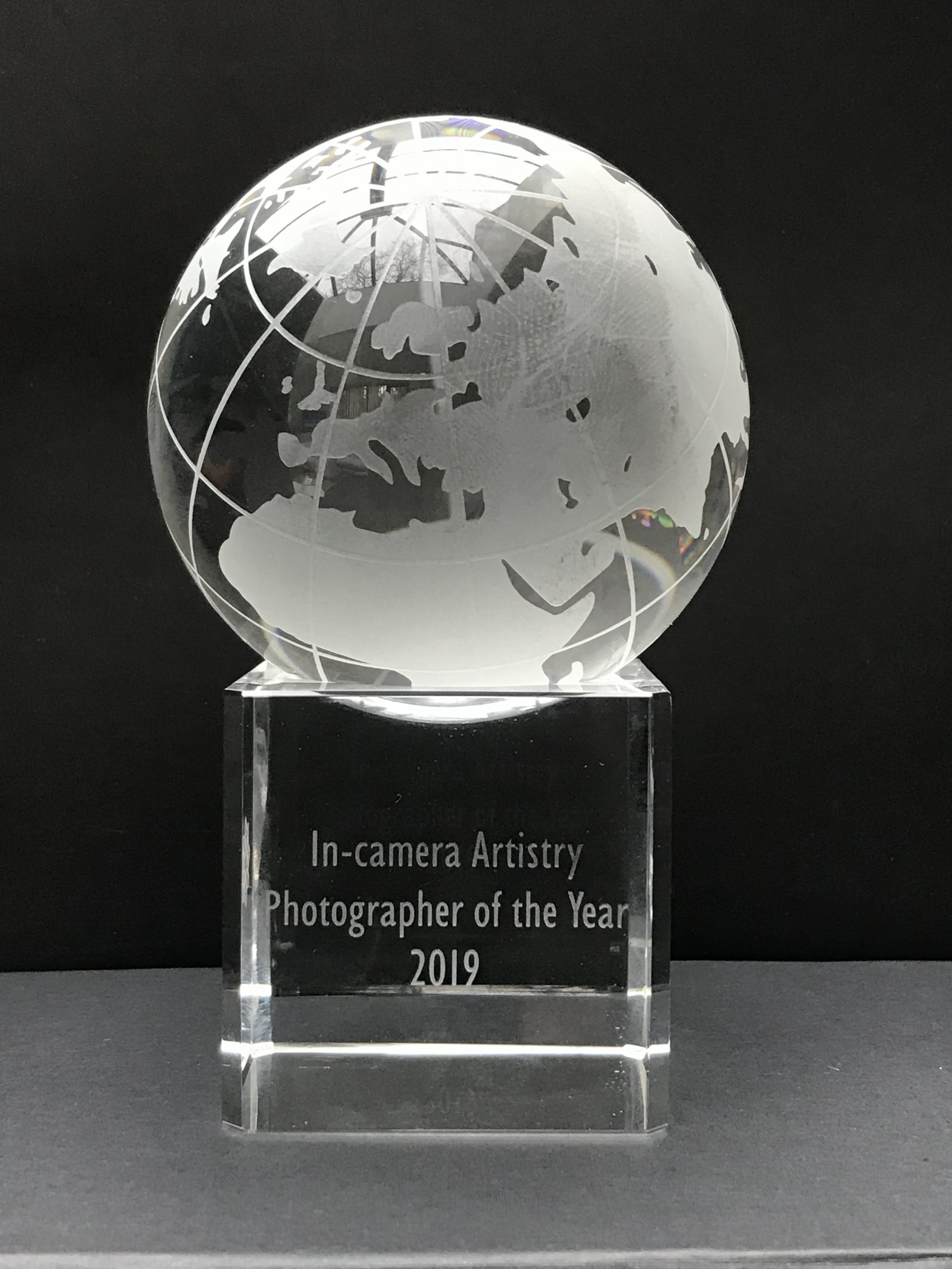 In Camera Artistry award from the SWPP rotating engraved globe on glass stand
