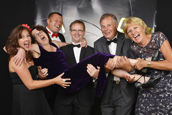 Group photograph shows guests having fun whilst attending Charity event black tie ball